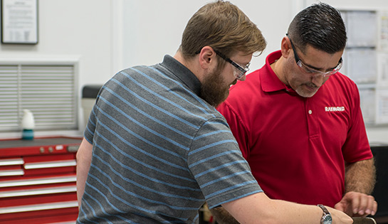 Two men working together