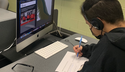 Manufacturing Day 2021 Manufacturing Day, Raymond Corp, Student watching virtual tour on a computer